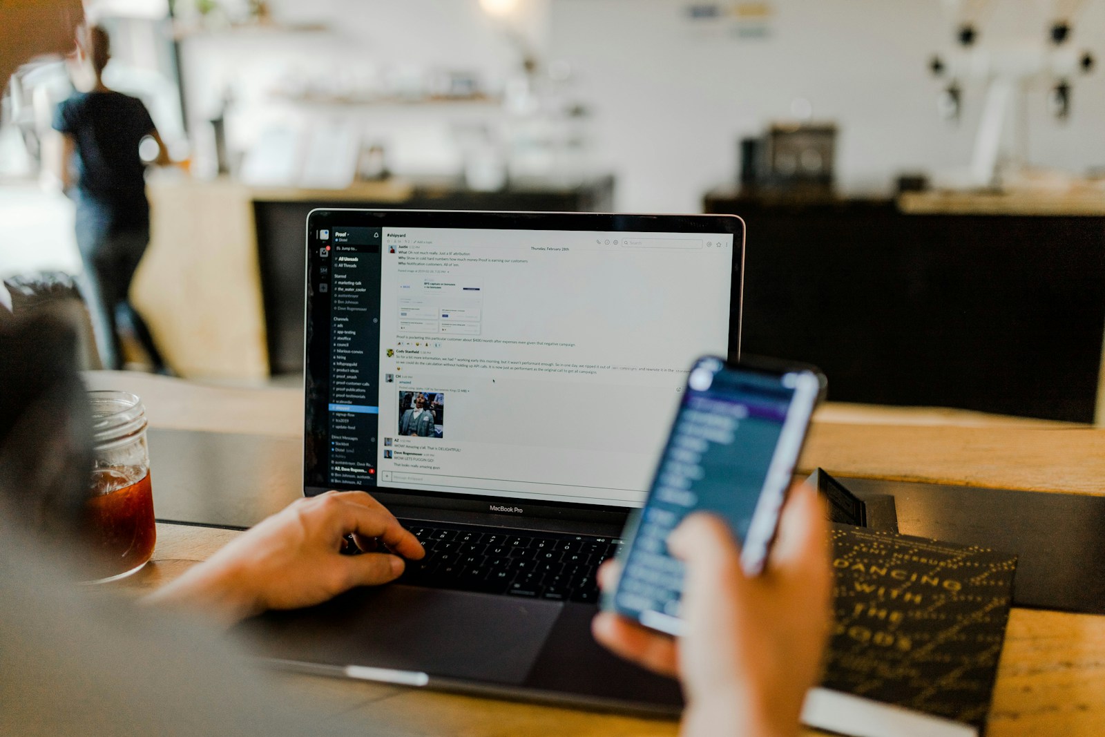 Team messaging in Slack on a desktop and a phone